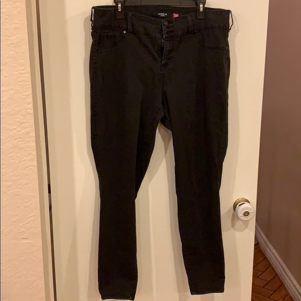 Lightly worn weathered black torrid denim